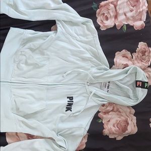A mint colored PINK brand zip up jacket